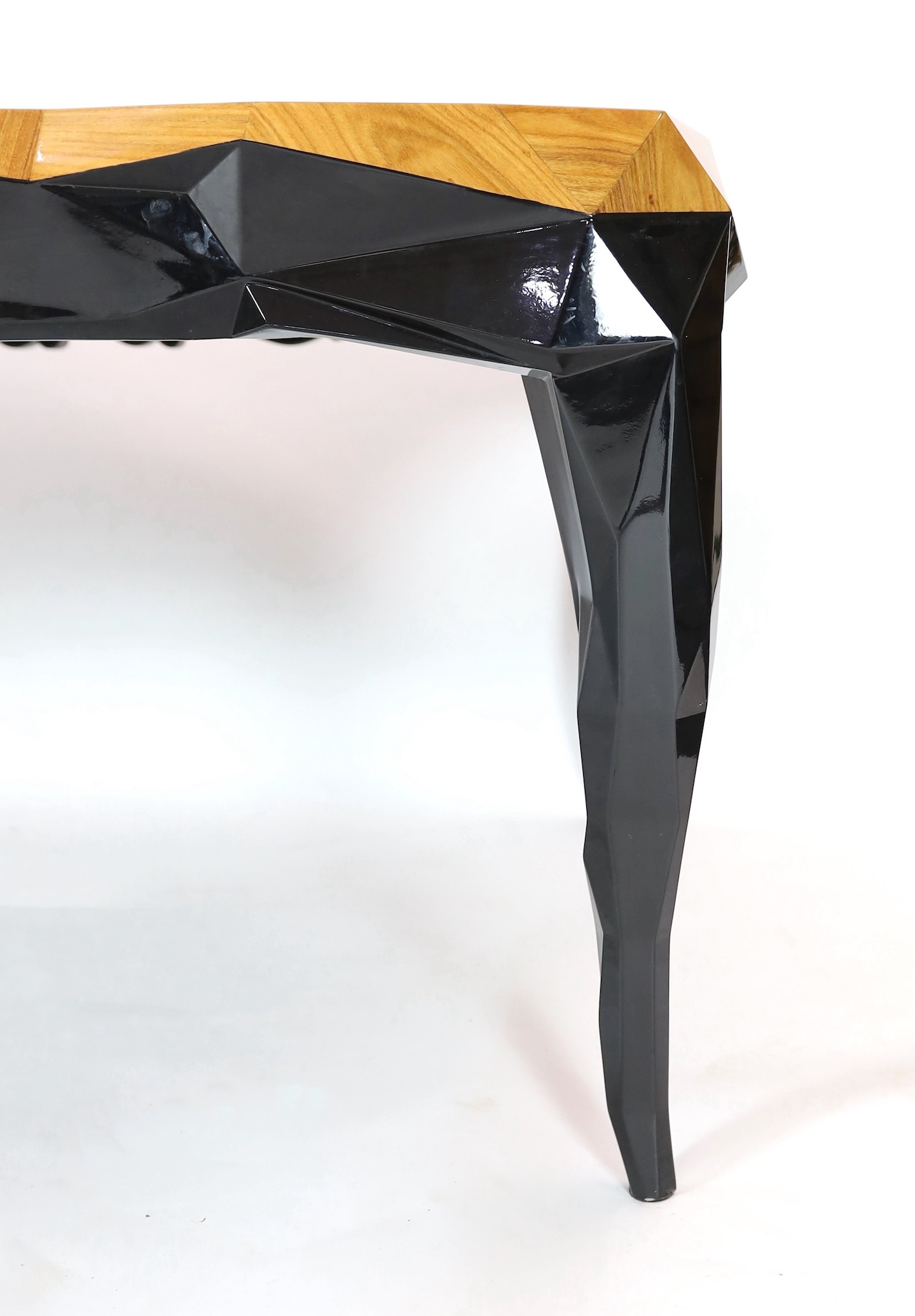 A contemporary Boca Do Lobo palissandre and black lacquer 'Royal' dining table, with parquetry veneered top on ebonised underframe with cabriole legs, scroll carved to two opposing legs and geometric carving to the other